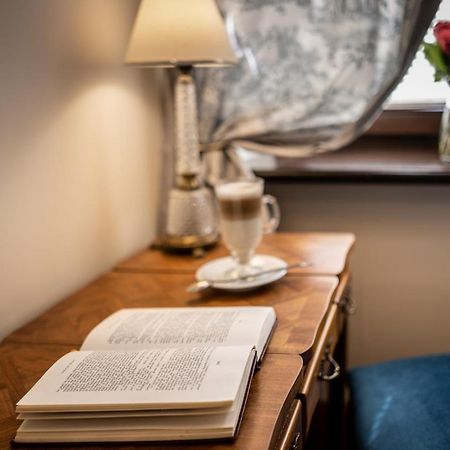 Hotel Grodek Krakow Luaran gambar A book on a table